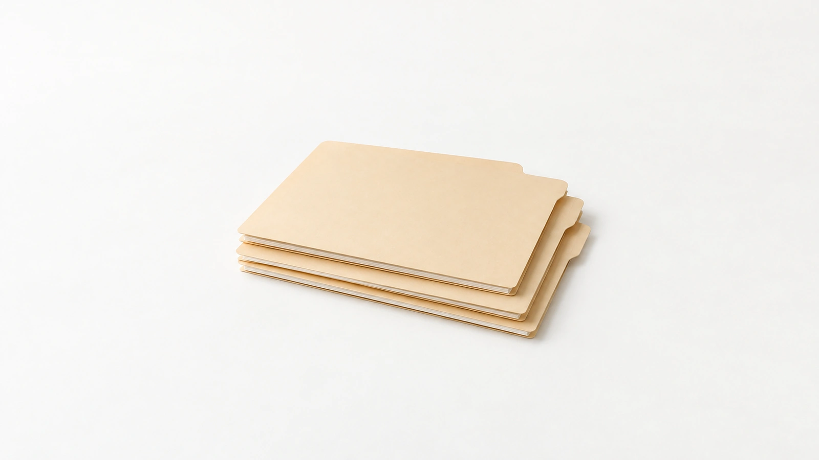 Blank manila client folders stacked on a light desk, with staggered tabs and room to organize incoming documents.
